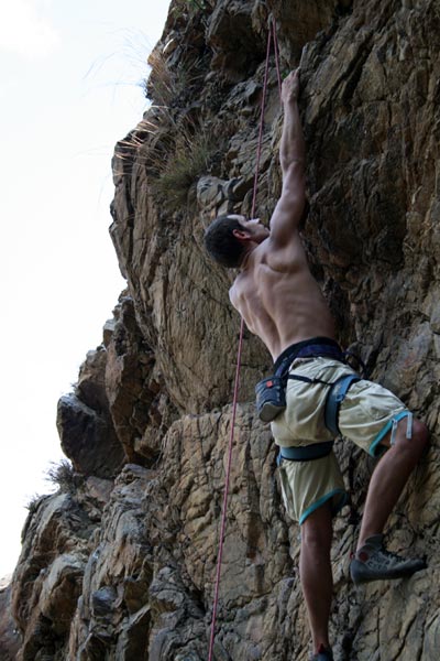 Ben rock climbing in Chancos