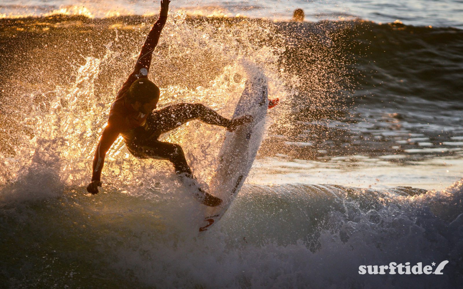 Photo of a surfer in mid-air at Supertubos, Peniche Beach