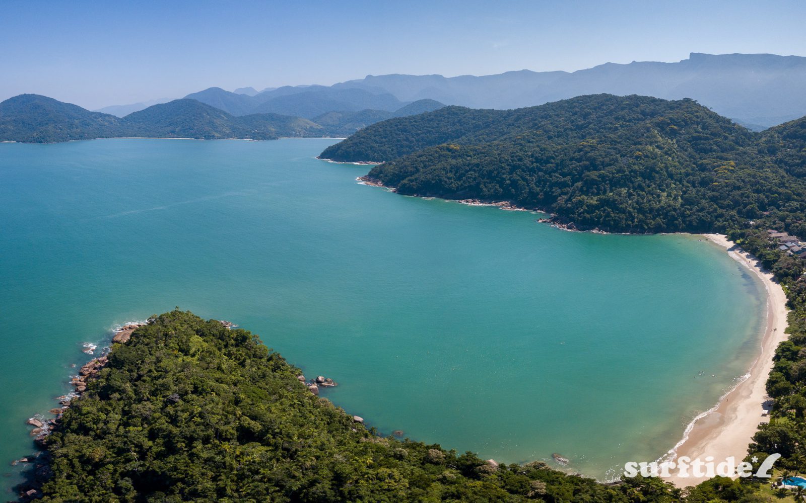 Aerial image of Domingas Dias beach with the mountains in the background