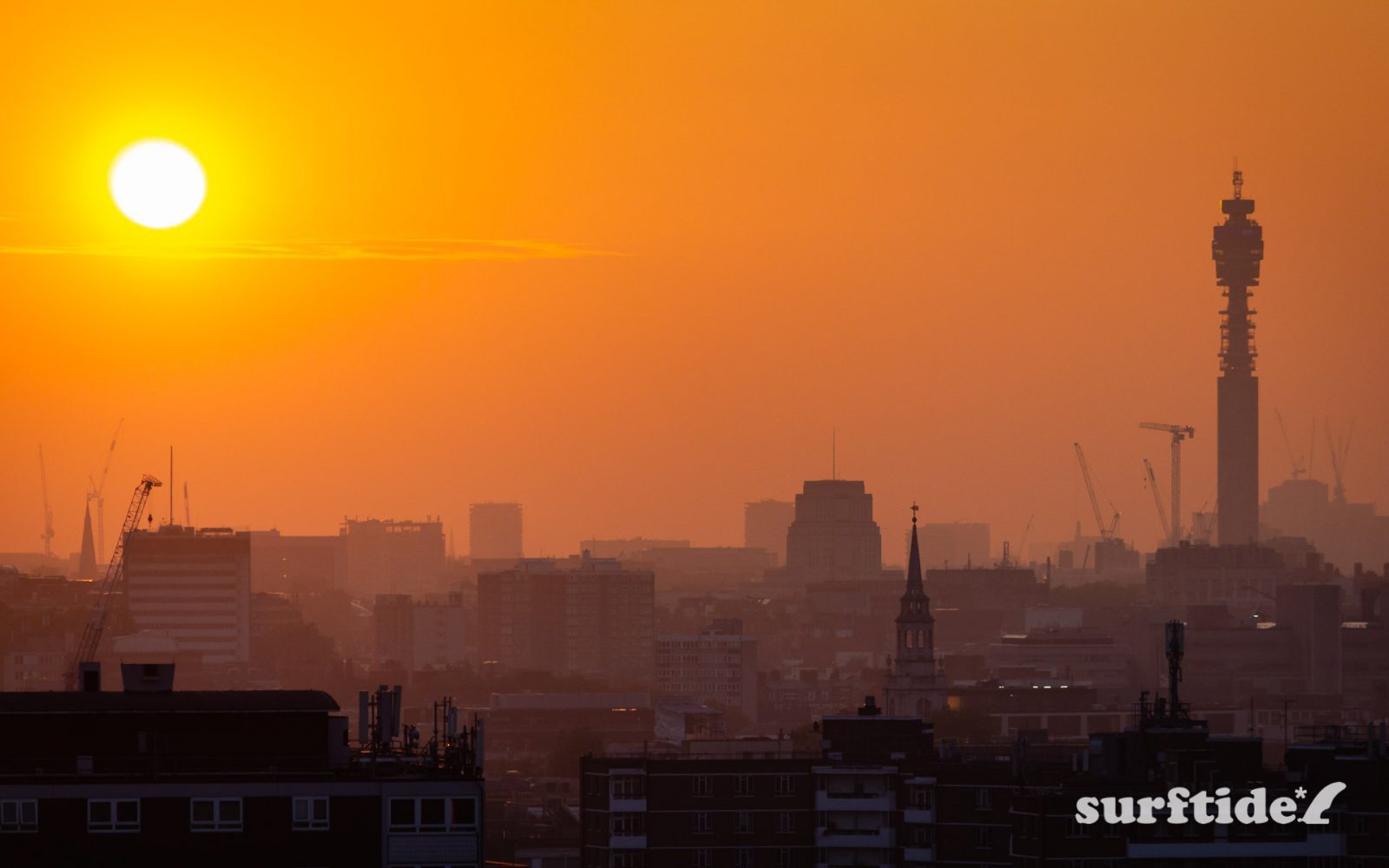 Sun setting across the skyline of London